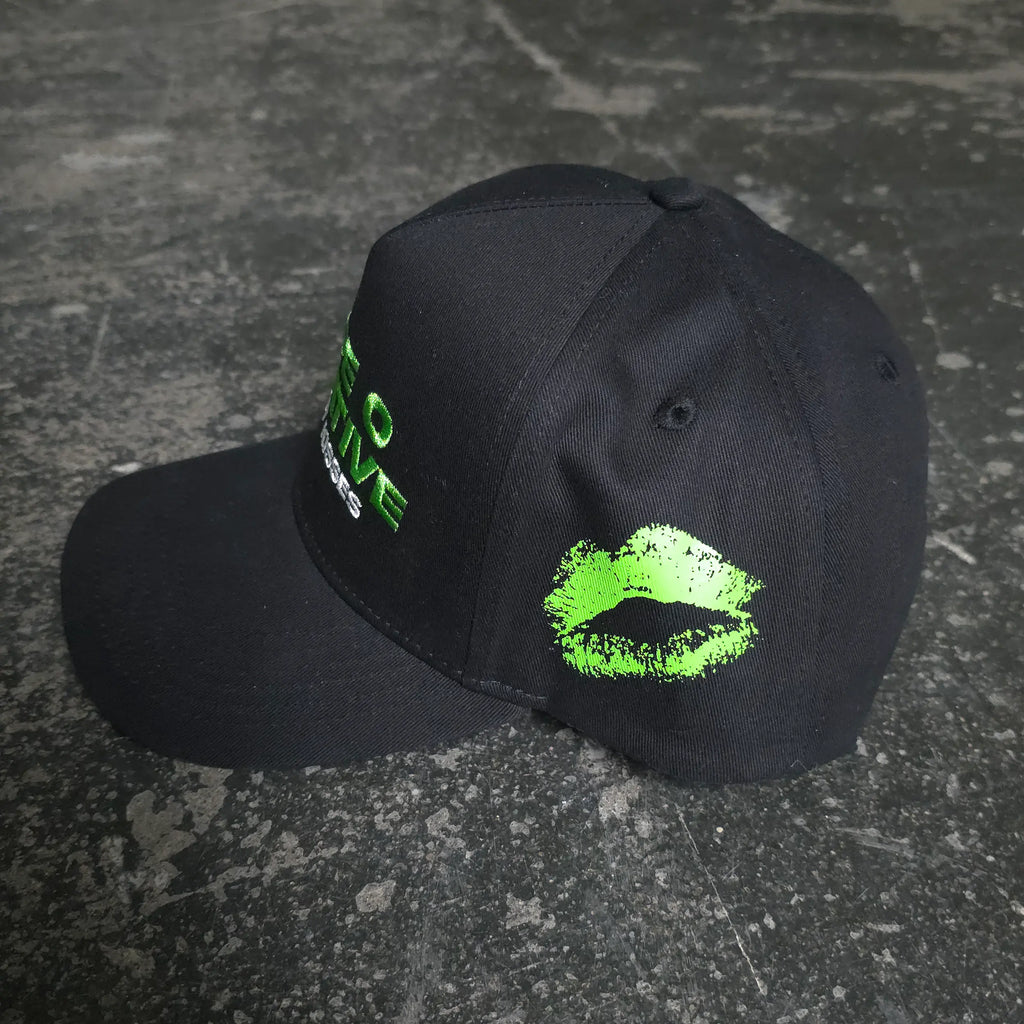 Black Bloody Kisses hat by Any Means Necessary Clothing, featuring bold graphic design and adjustable strap.