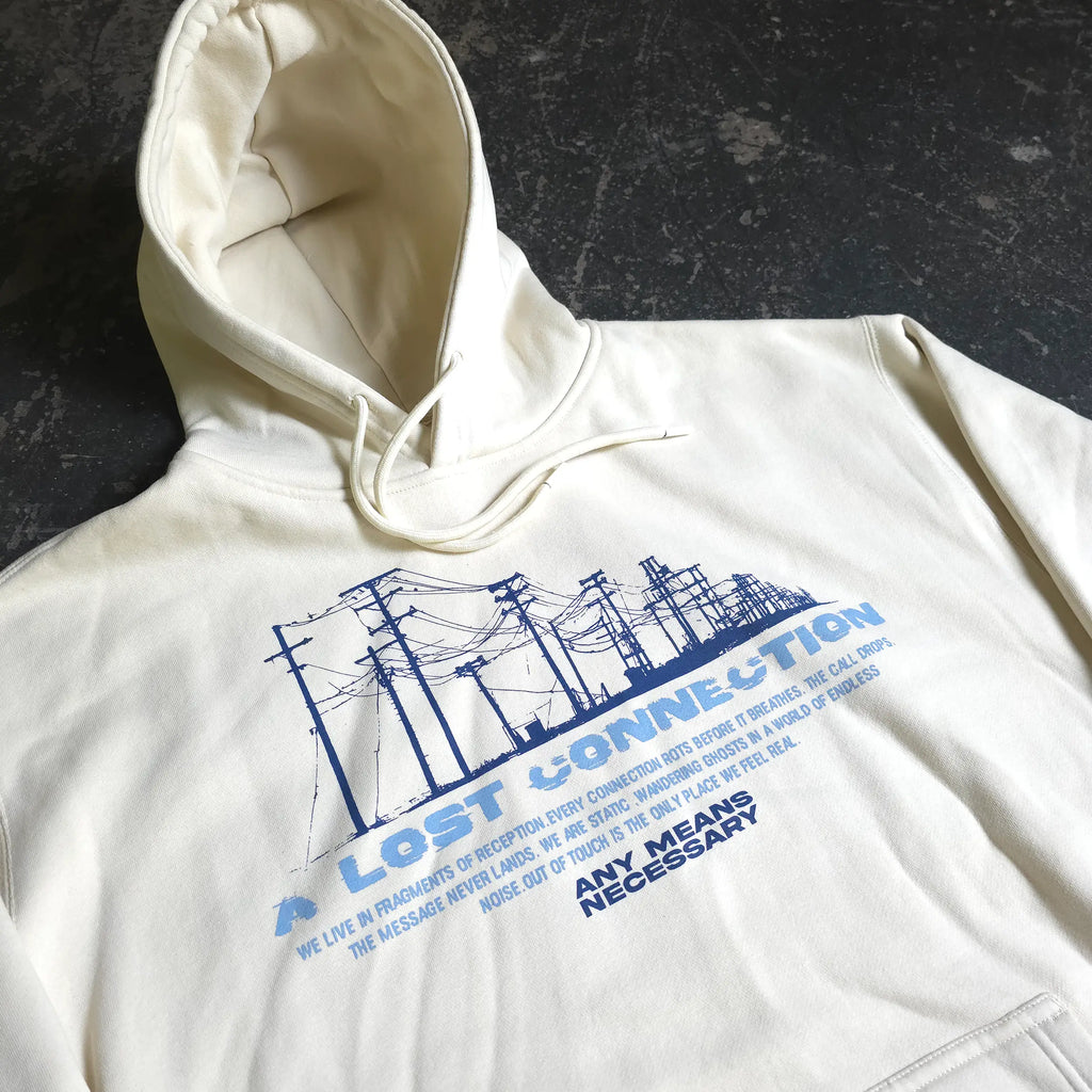 Bone-colored hoodie from Any Means Necessary Clothing with "Lost Connection" text, featuring a casual pullover design.