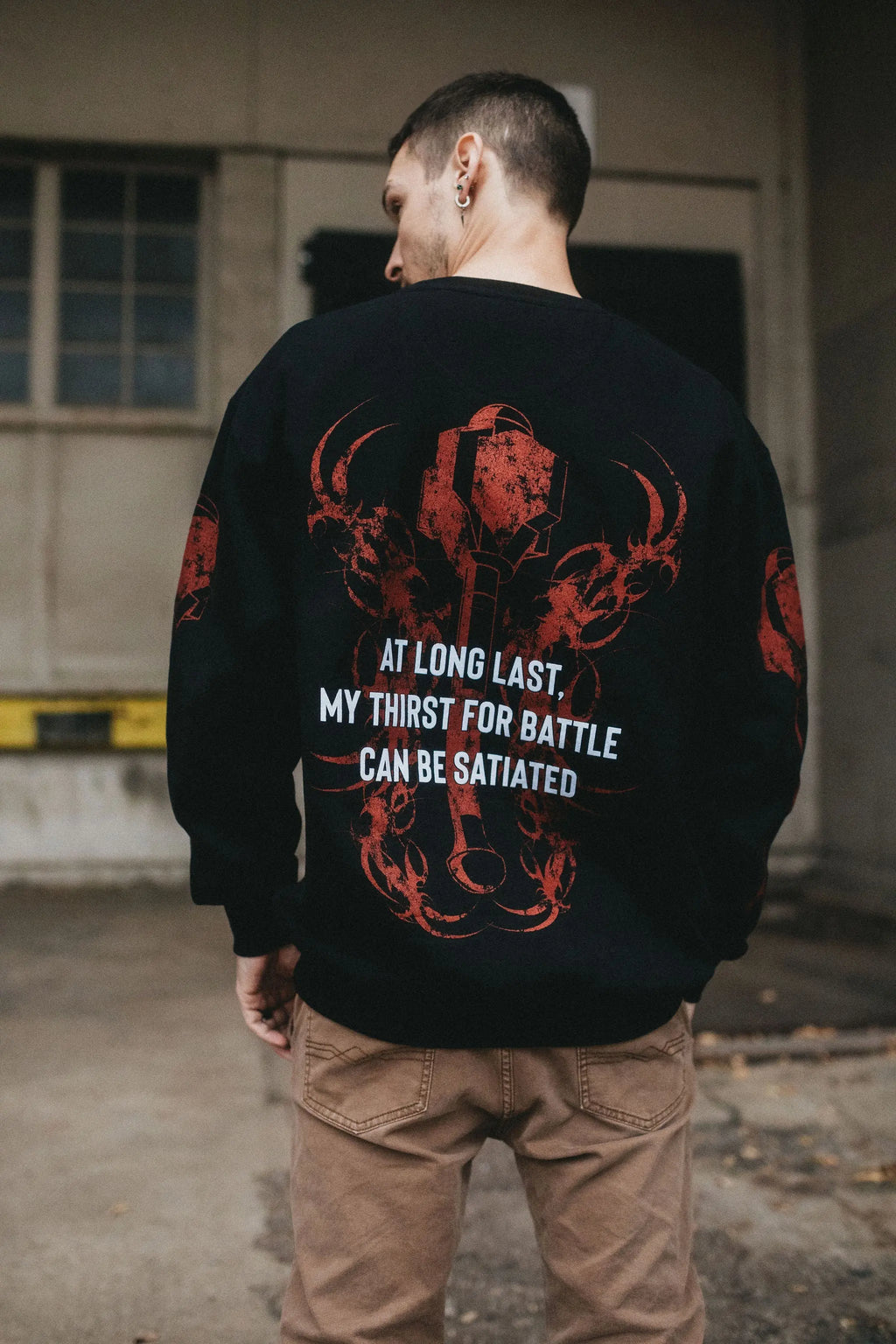 Any Means Necessary Clothing Thirst For Battle crewneck sweatshirt, featuring a hoodie design with bold graphic print.