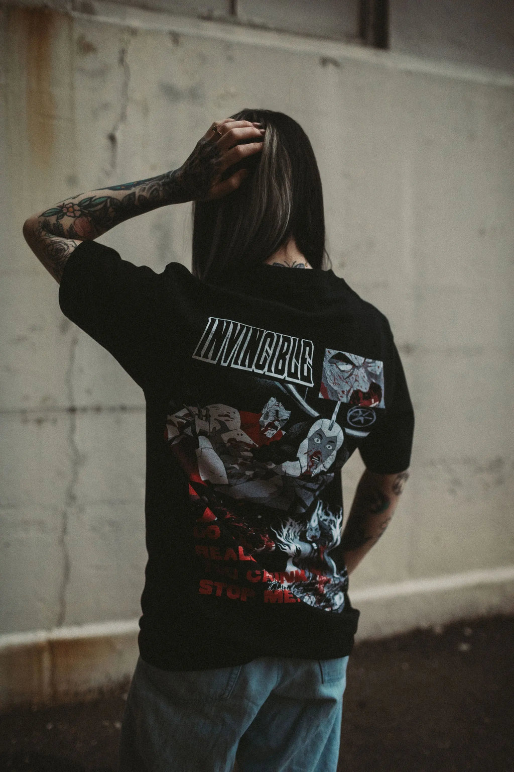 Black Neck Snap T-Shirt from Any Means Necessary Clothing featuring a classic crew neck and snap button details.